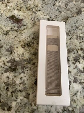 Brand new Fitness wristband compatible with Versa 3 size small. Champagne color